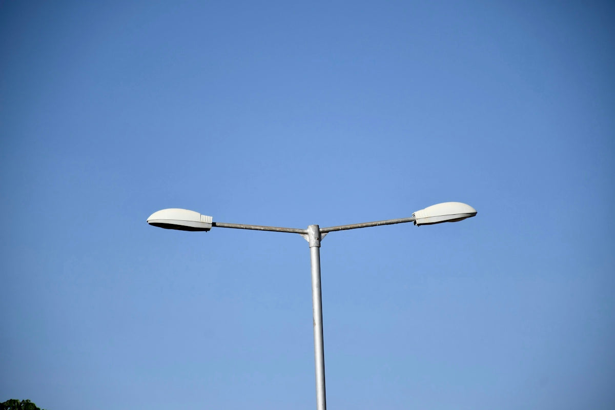 a street light with a clear blue sky in the background