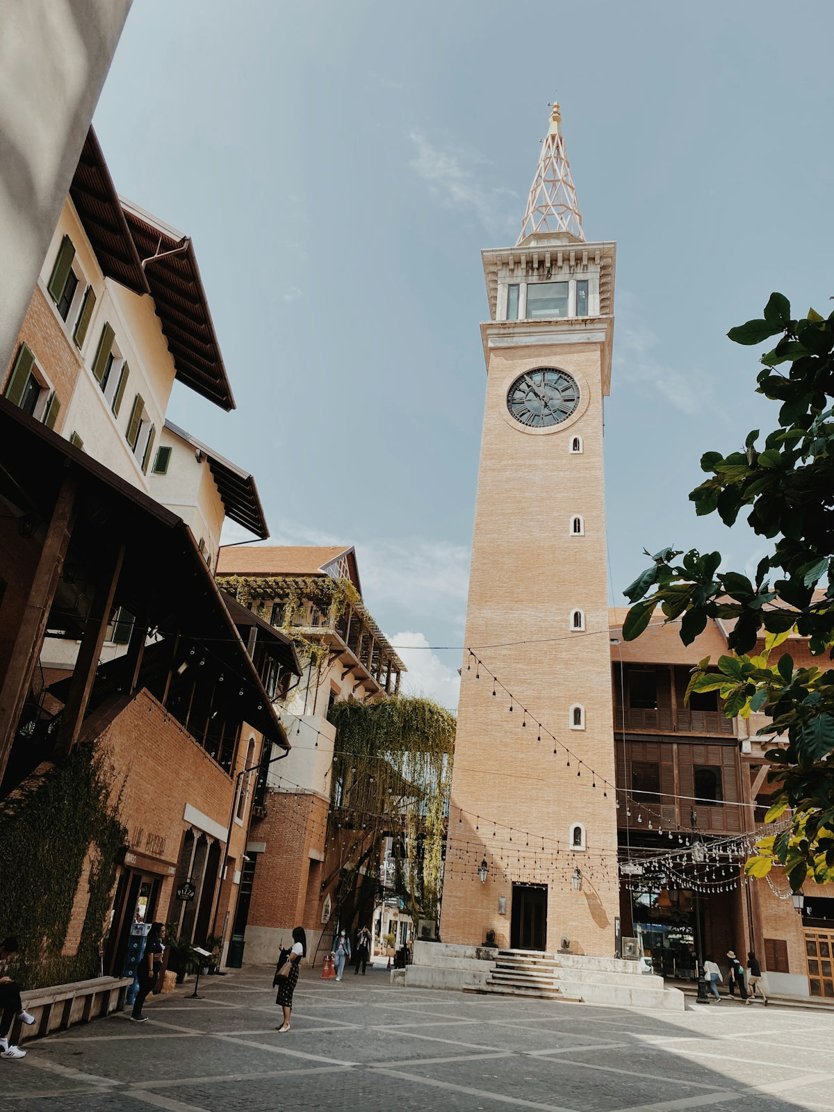 a tall tower with a clock on the top of it